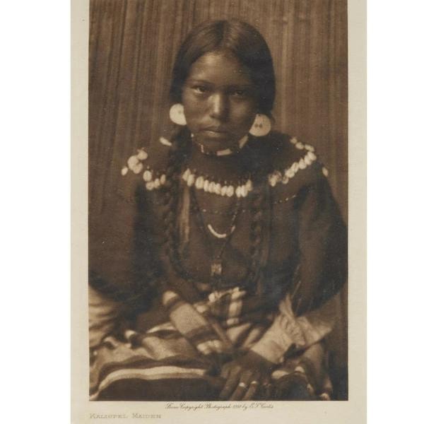 Edward S. Curtis — Kalispel Maiden, young Indigenous woman with shell disc earrings, beaded necklace and braids, sepia photogravure 1910
