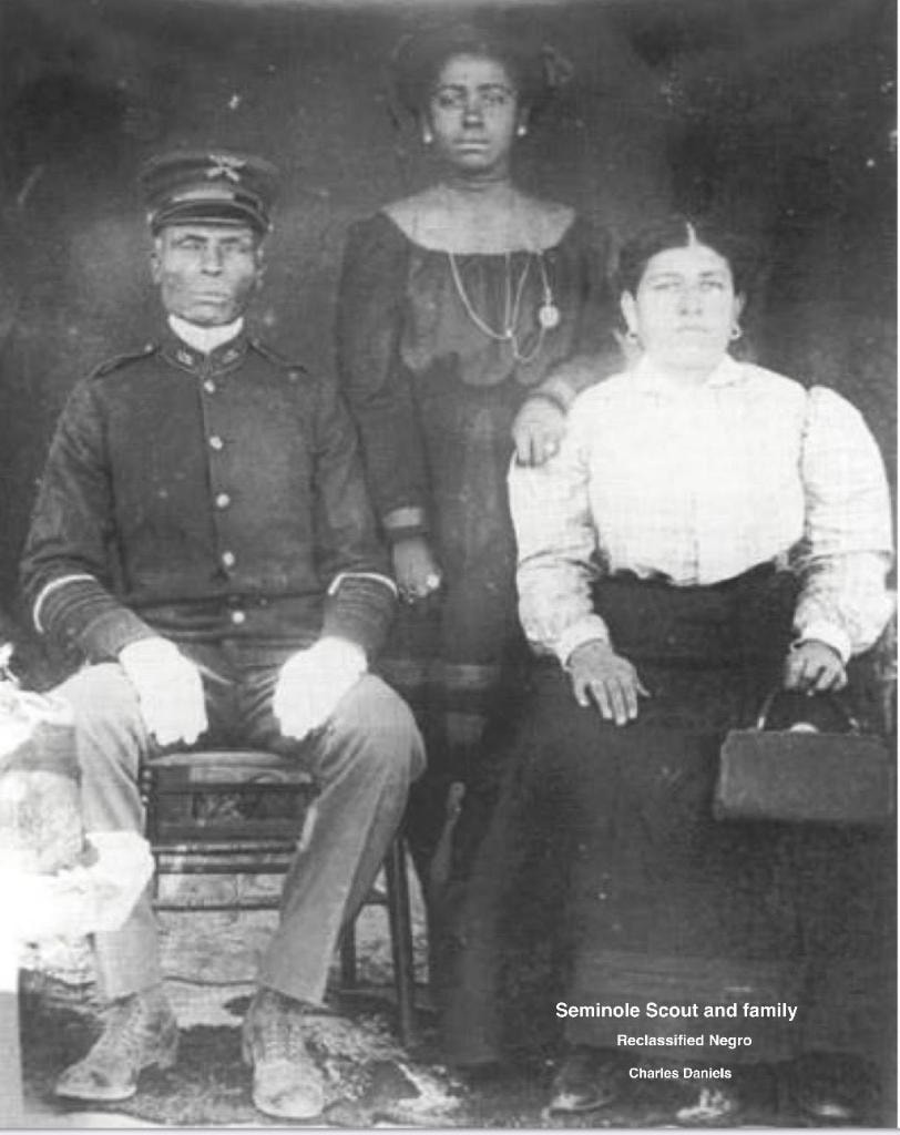 Seminole Scout Charles Daniels and family — officially reclassified as Negro despite Indigenous heritage, historical photograph