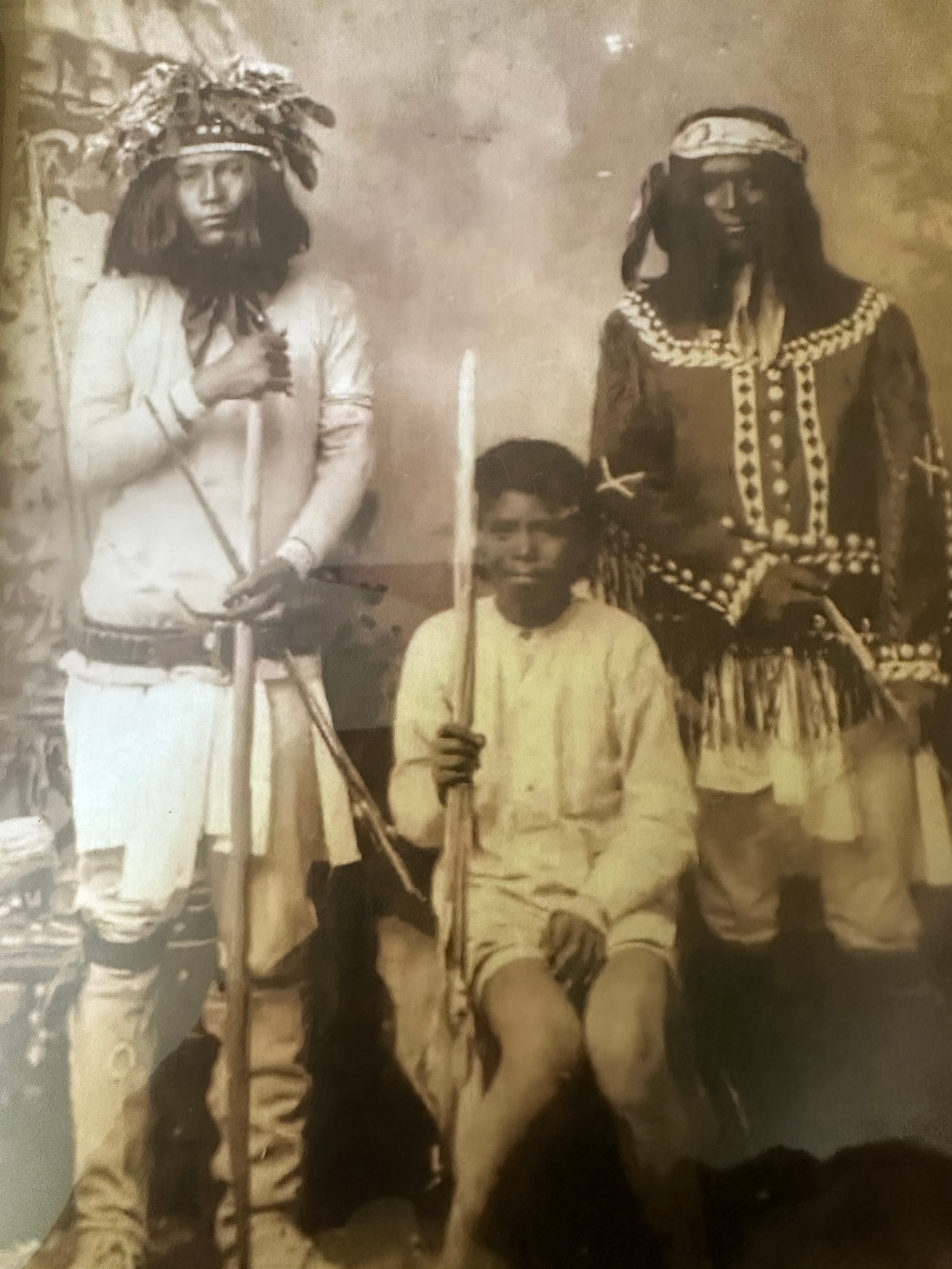 Indigenous warriors in ceremonial regalia