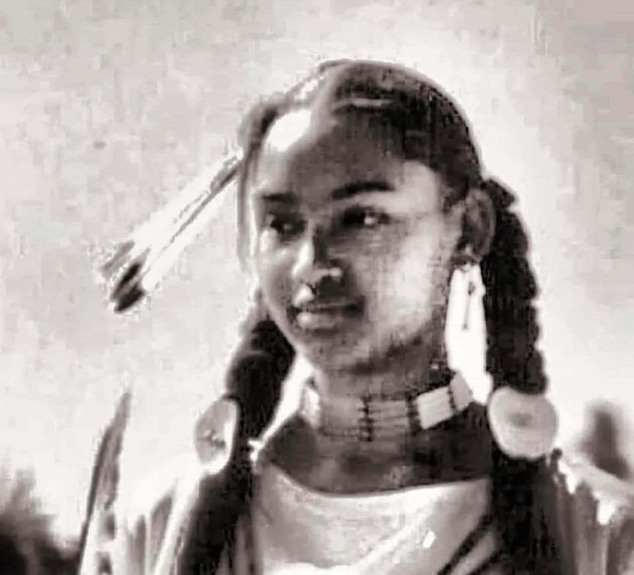 Young woman with braids and beaded choker
